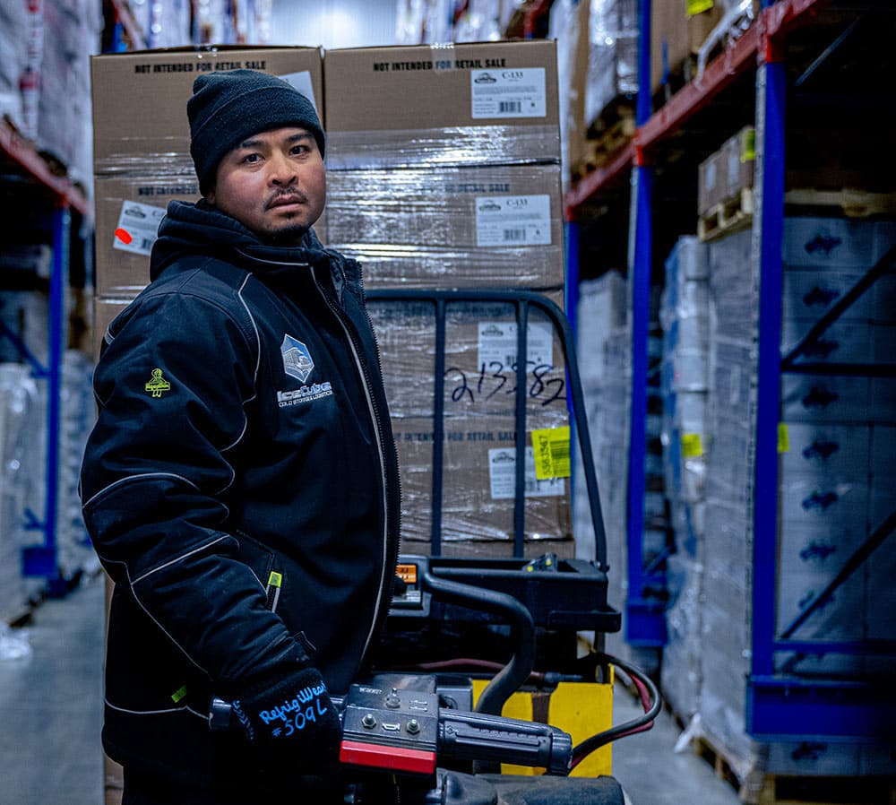 Forklift driver in cold storage facility