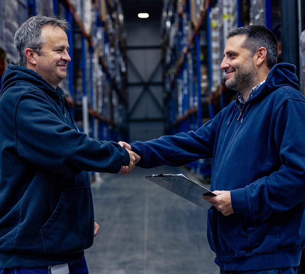 Cold Storage worker and client shaking hands